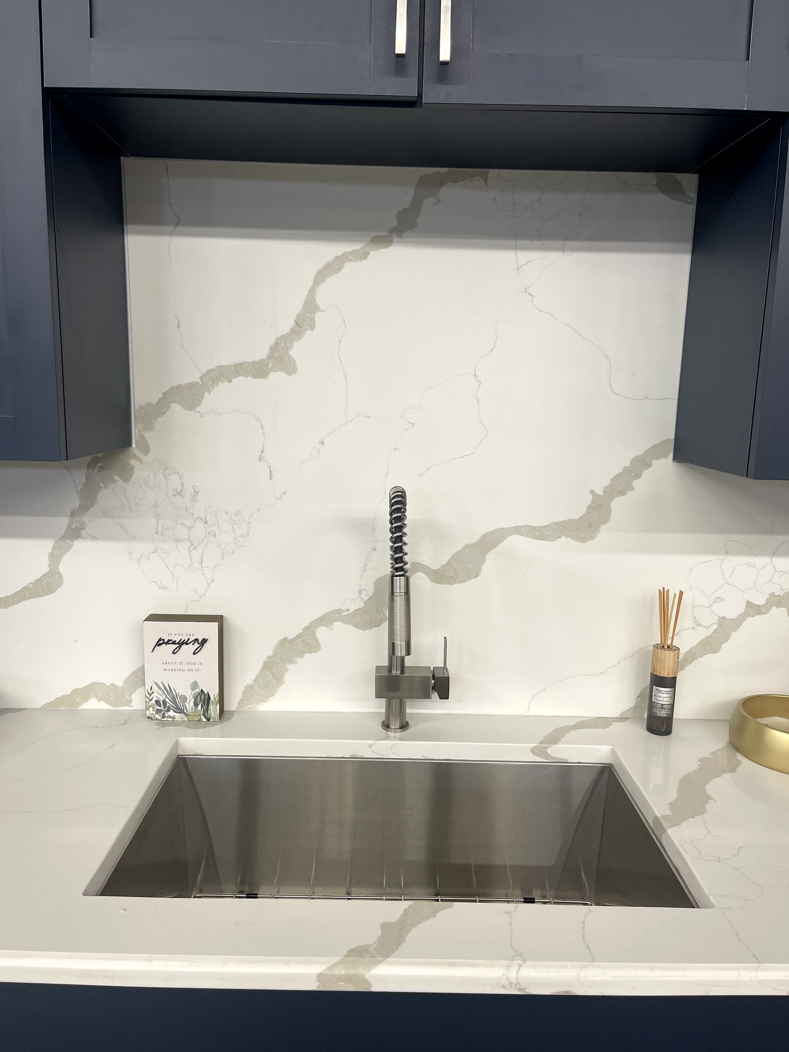 Sink area with granite counter and backsplash