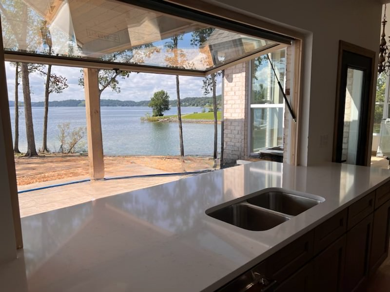 Quartz countertops in kitchen overlooking a lake