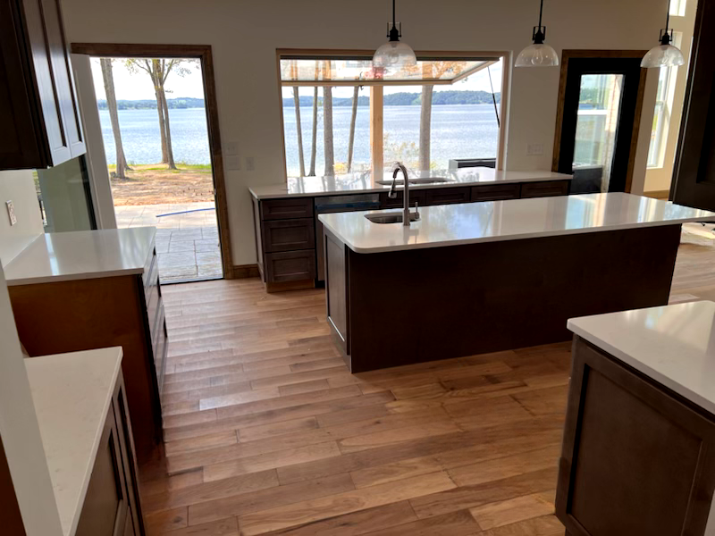 Quartz countertops in kitchen overlooking a lake